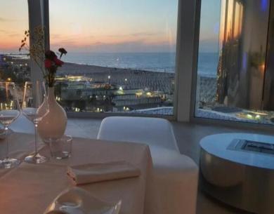 Romantic dinner with a sunset sea view.