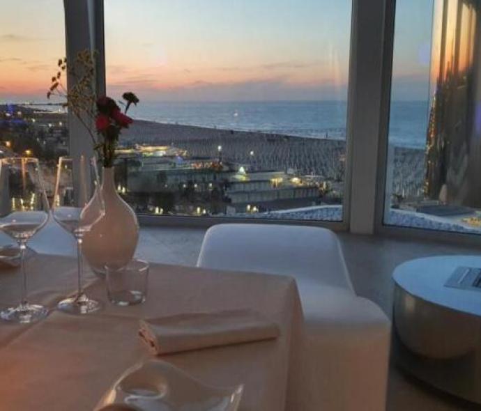 Romantic dinner with a sunset sea view.